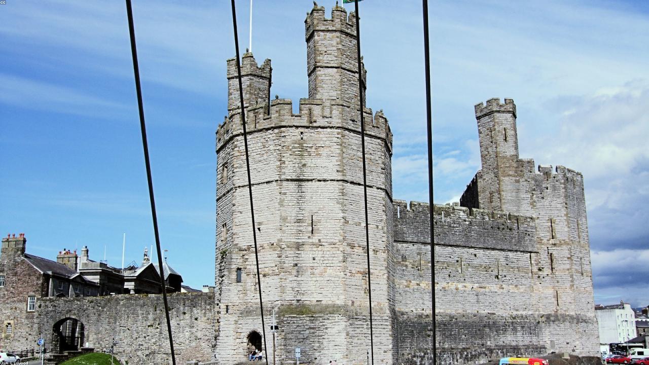 Caernarfon Castle polygonal towers with banded sandstone rising above the Menai Strait