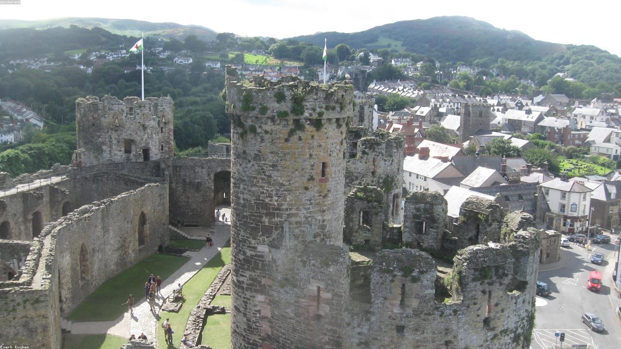 Conwy Castle eight towers and medieval town walls reflected in the Conwy estuary