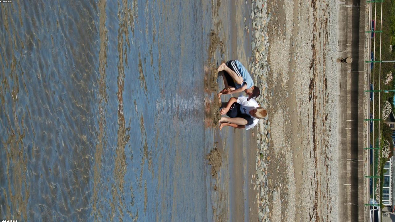 Criccieth east beach below the castle headland with Cardigan Bay beyond
