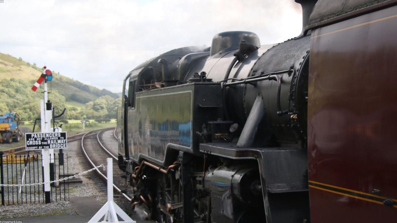 Steam locomotive on the Llangollen Railway crossing a viaduct above the River Dee in the wooded gorge