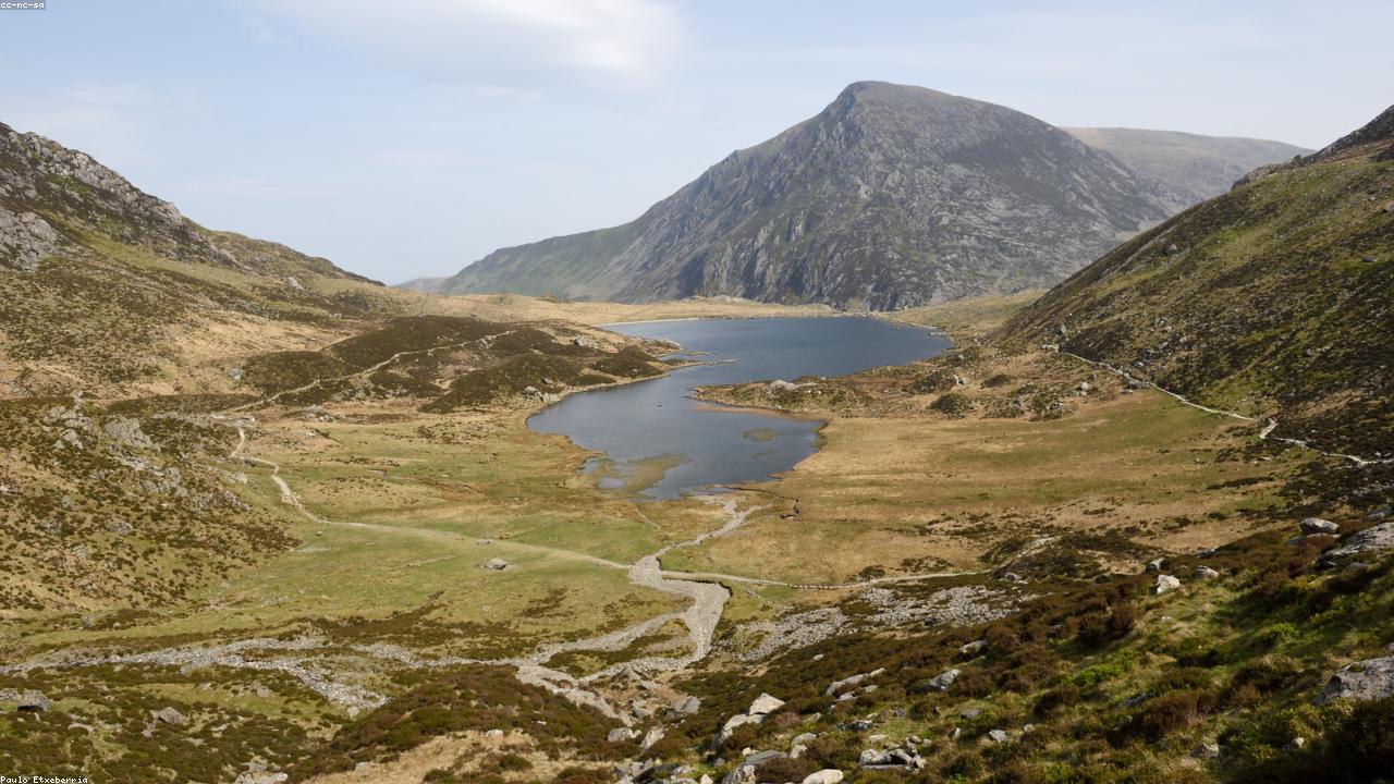 Wild swimmers in Llyn Idwal on a summer day with mountains behind