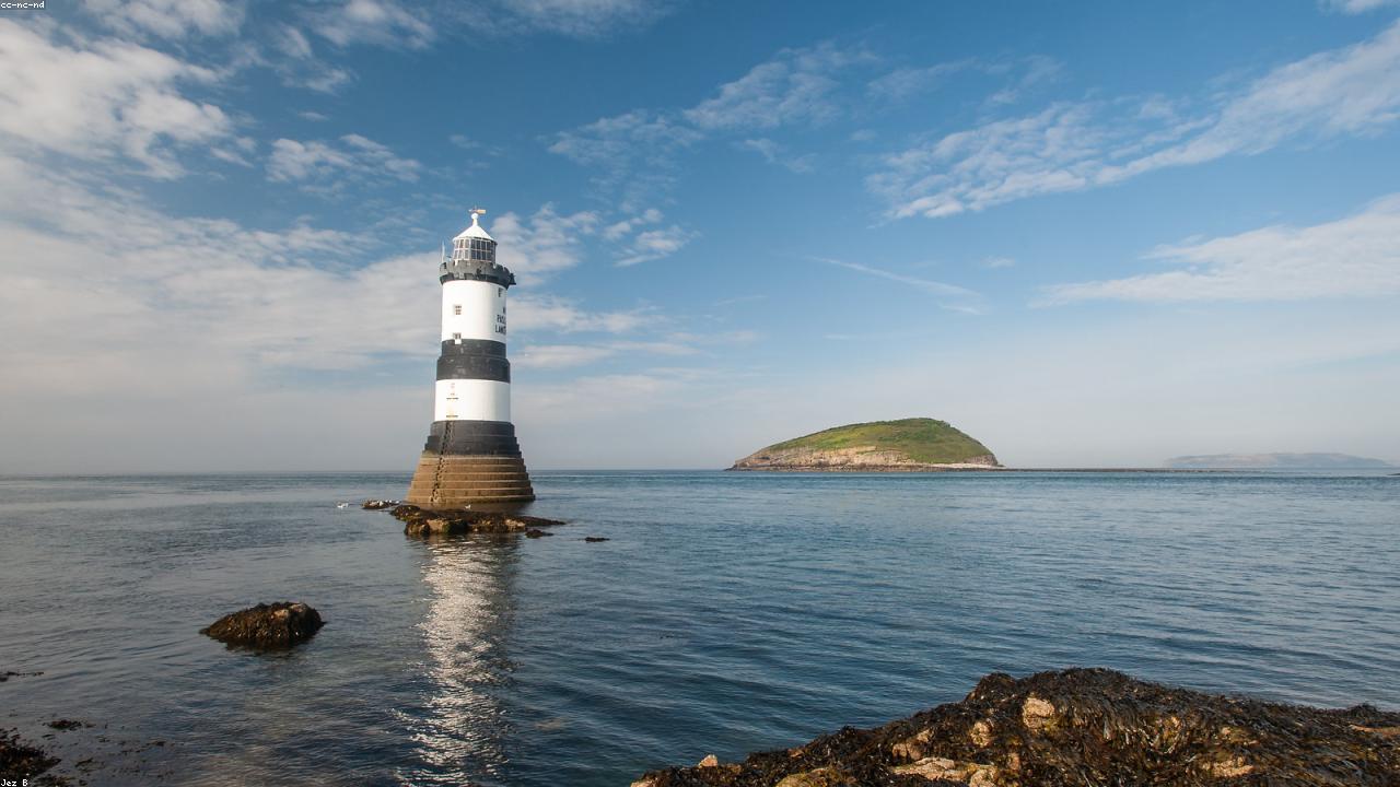 Penmon Point looking across to Trwyn Du lighthouse and Puffin Island on a clear day