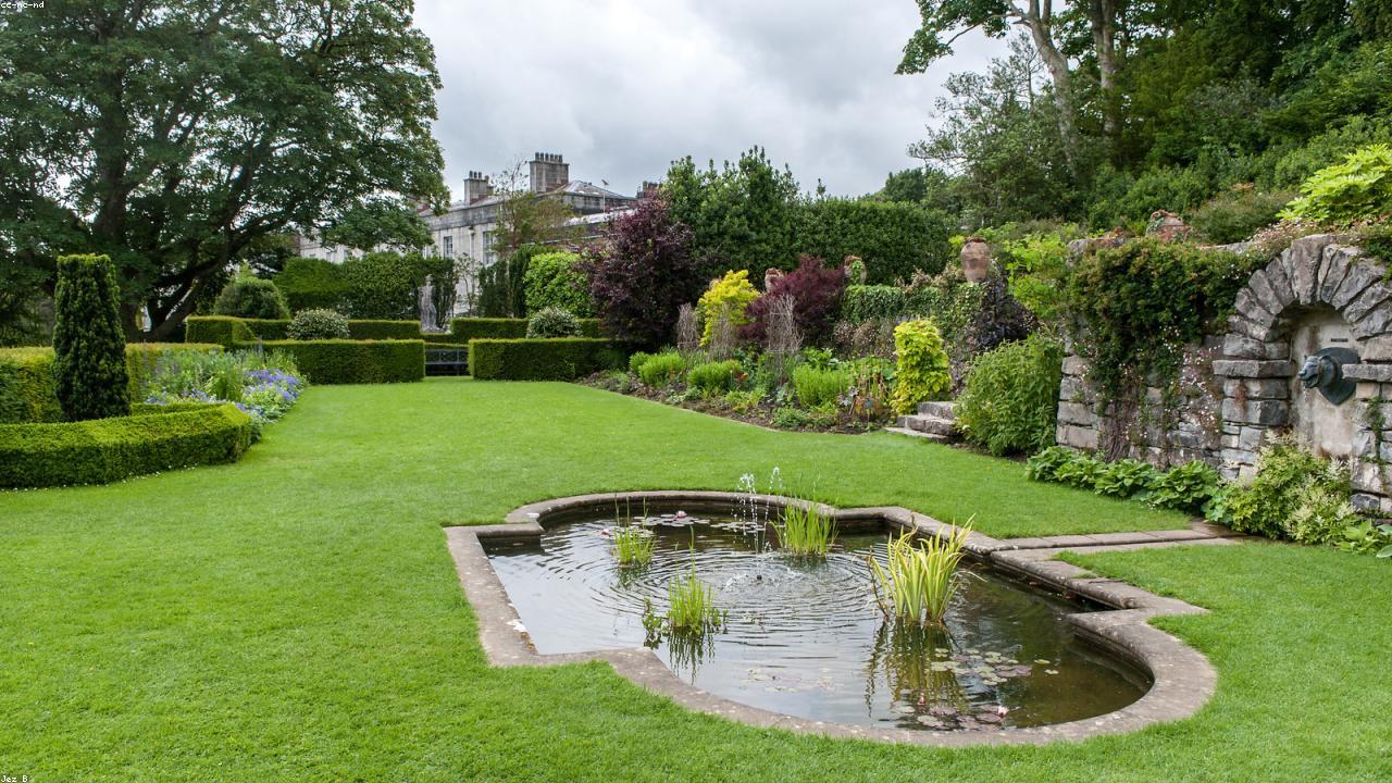 Plas Newydd house and gardens above the Menai Strait with Snowdonia beyond
