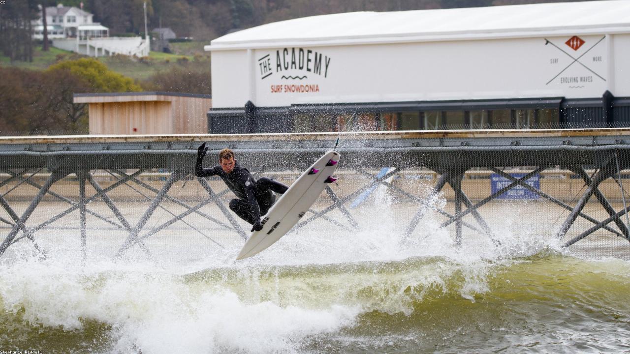Adventure Parc Snowdonia inland surf lagoon with Snowdonia mountains behind