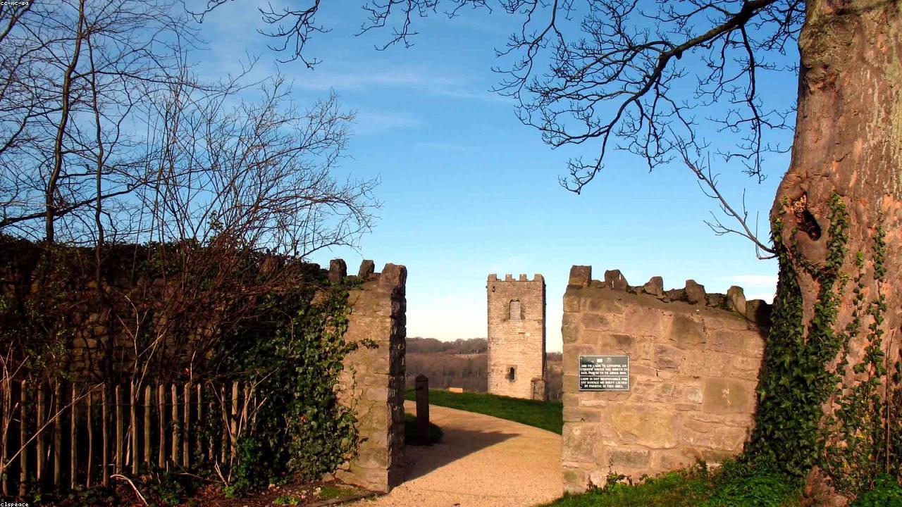 Denbigh castle ruins and medieval town walls on the hilltop above the Vale of Clwyd