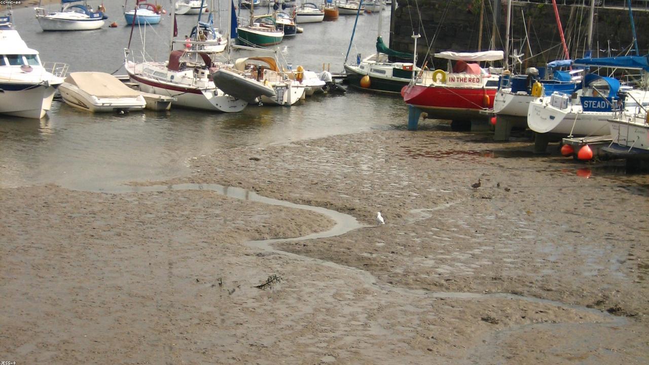 Porthmadog harbour with the Ffestiniog Railway and Snowdonia mountains behind